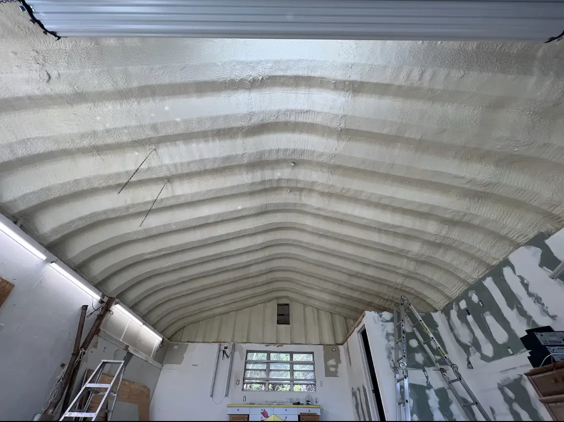 Spray polyurethane foam applied to the underside of a metal roof deck in Rocklin